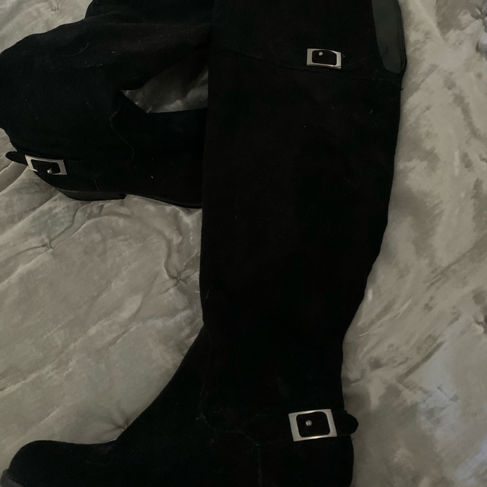Black over the knee riding boots.